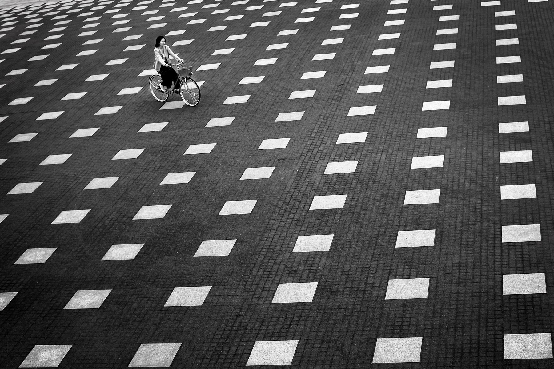 yancho sabev photography, monochrome, outdoor, Japan, high angle view, pattern, square, bicycle, black and white, one person, Yancho Sabev
