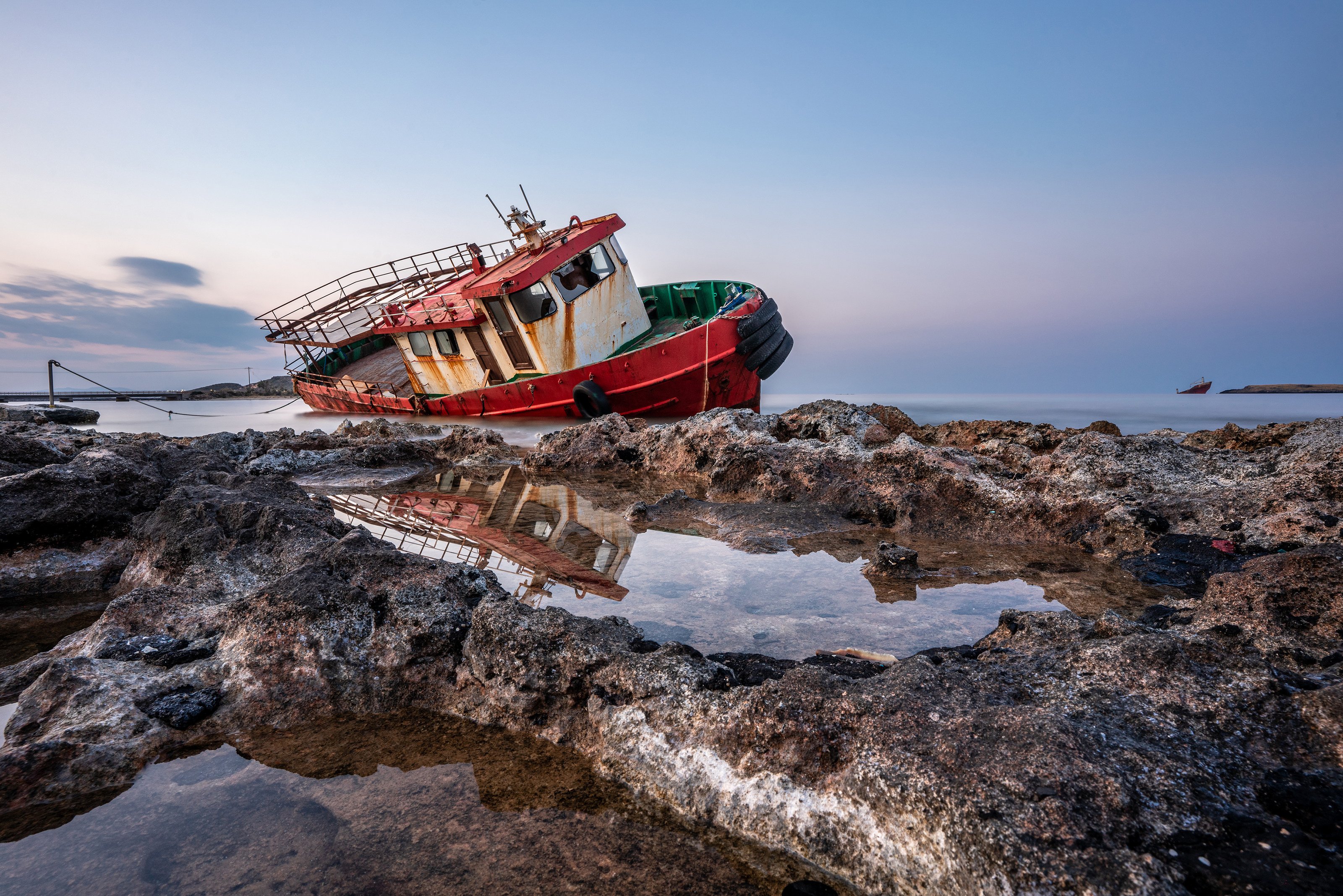 Greece; Kithera; Kithira; blue; boat; coast; dusk; old; red; reflection; rock; rusty; sea; shipwreck; sky; stone; stranded; water, Milan Ljubisavljevic