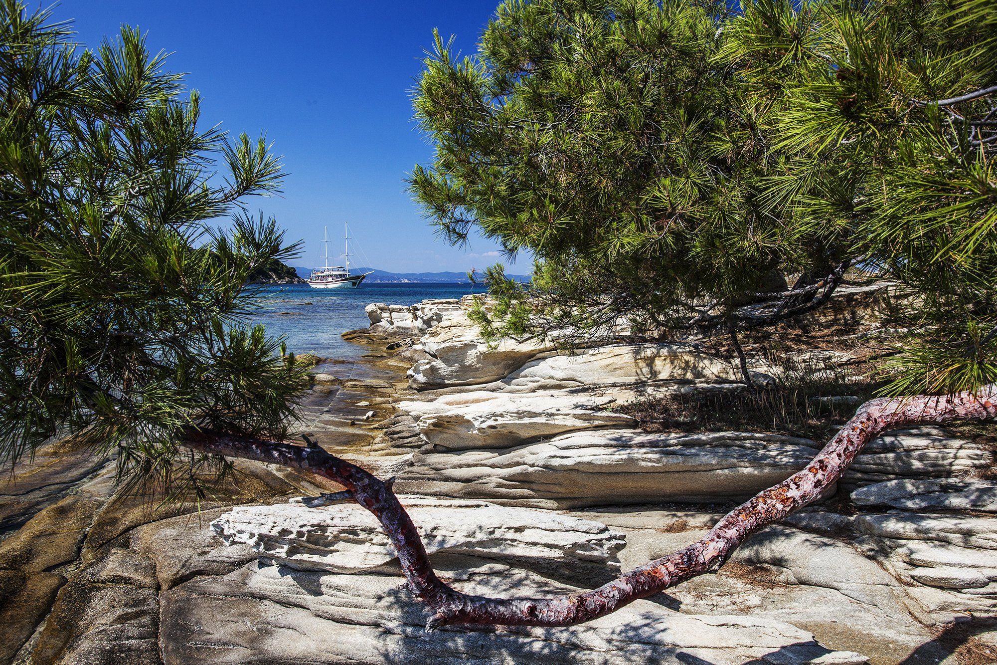 Greece, Halkidiki, Sithonia, blue-green sea, blue sky, white ship rocks., Borislav Tolev