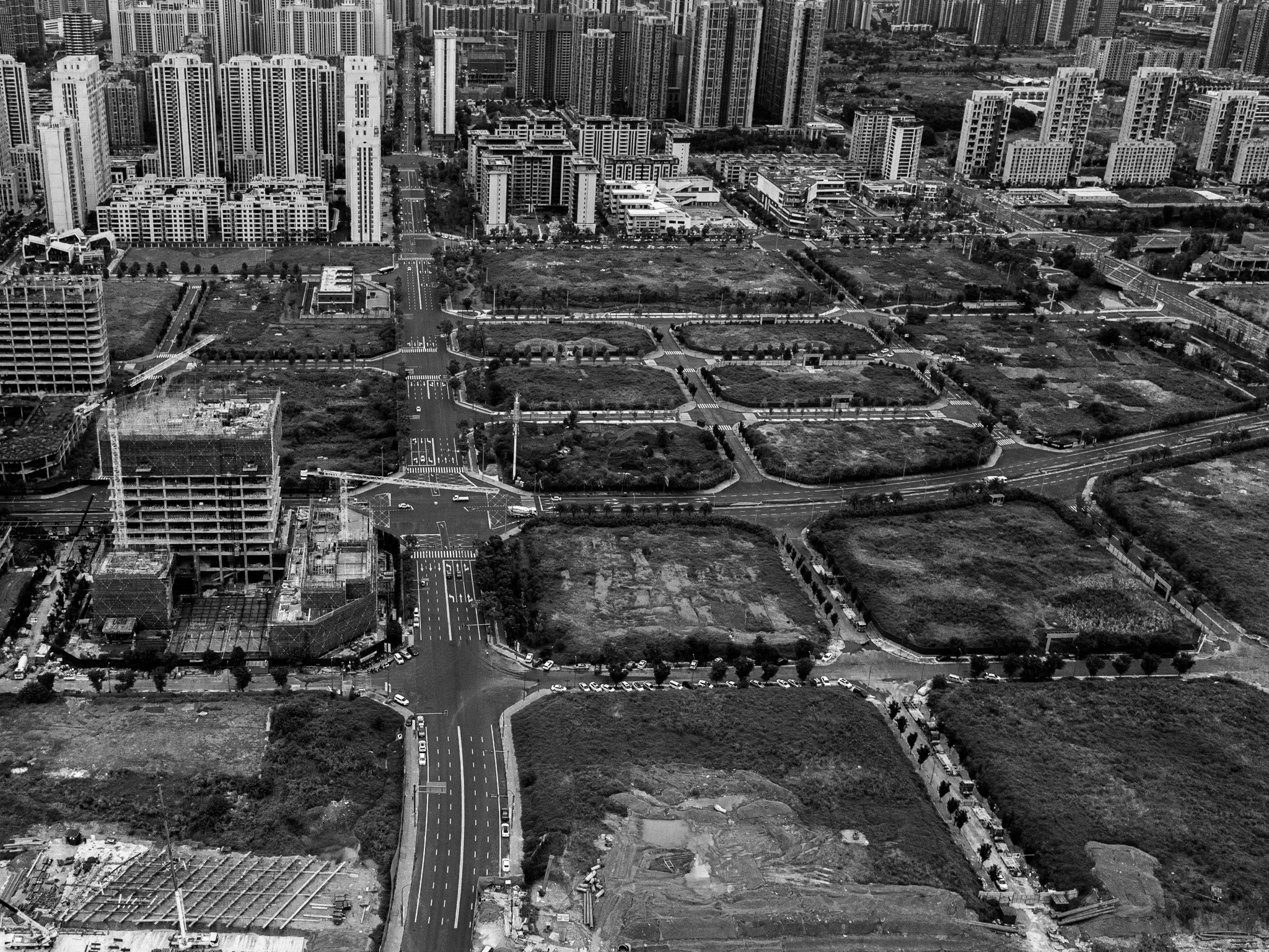 construction, city, megalopolis, black and white, tall buildings, river, bird's eye view, aerial view, field, land, roads, streets, trees, grass, Druz Denys