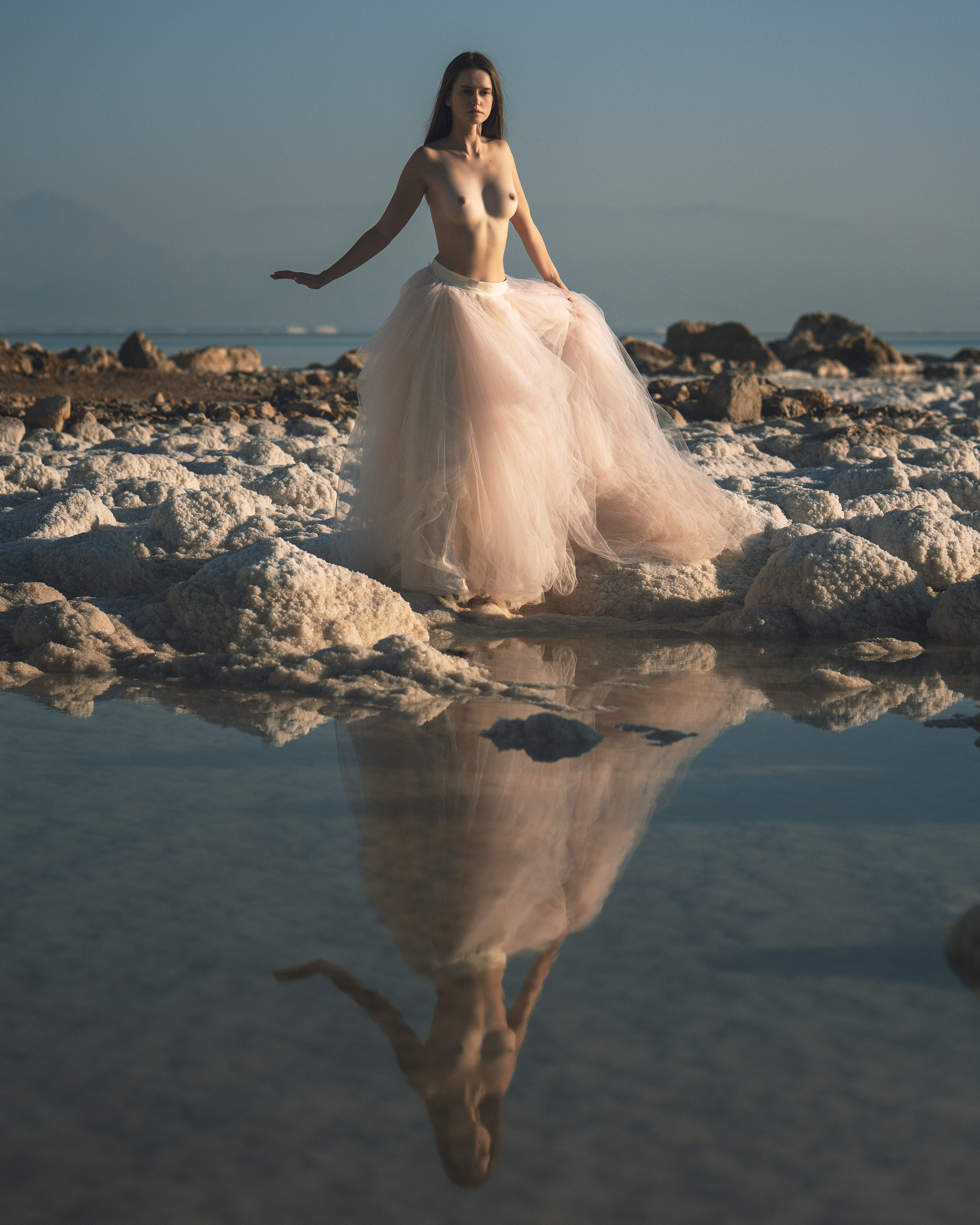 ball gown, beautiful woman, dead sea, desert, dreaminess, elegance, femininity, front view, golden hour, grace, looking, nude, one person, outdoors, reflections, rocks, salt, seductive women, sensuality, sky, standing, stones, sunset, water, young women, Alex Tsarfin