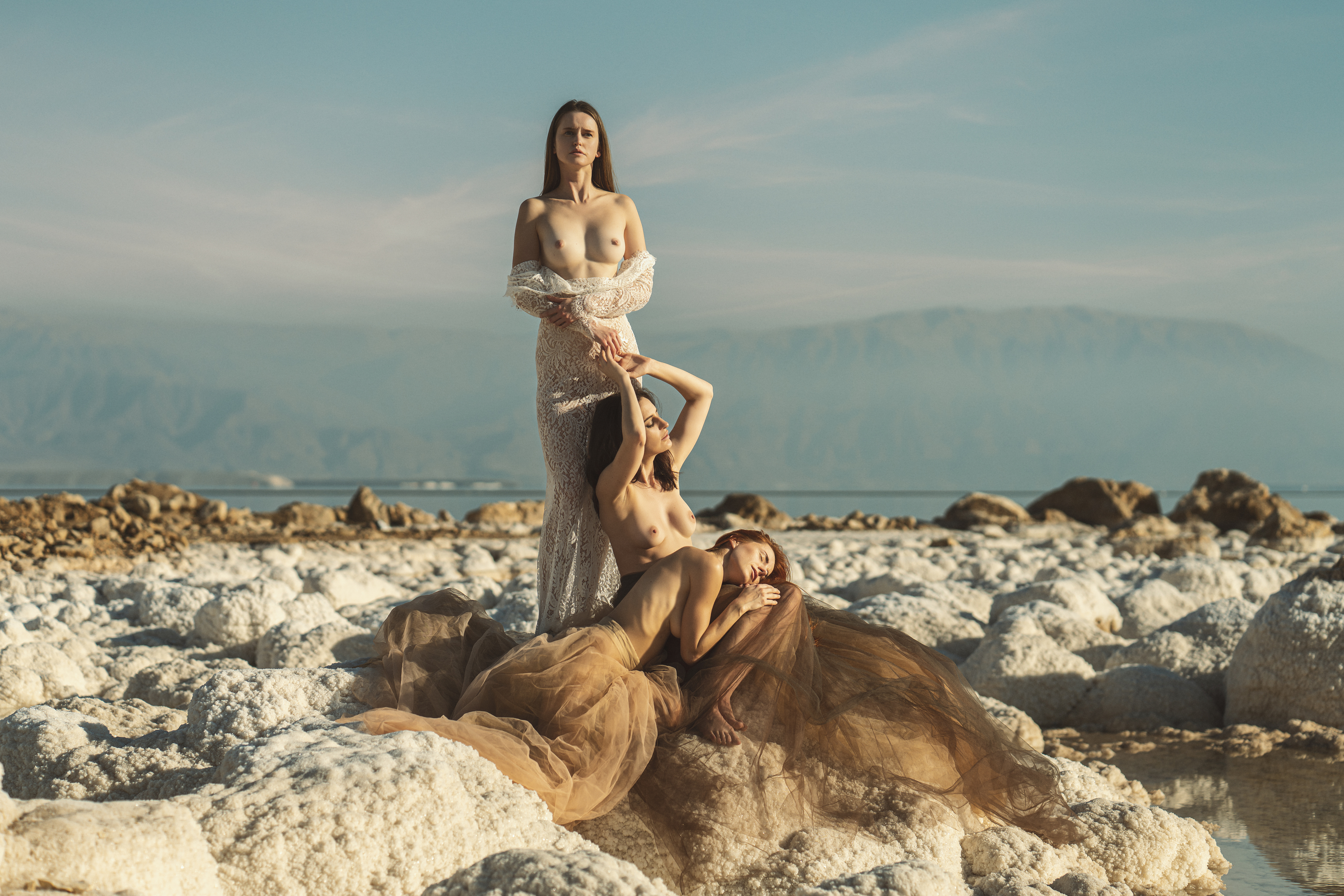 ball gown, beach, beautiful woman, clouds, dead sea, desert, dreaminess, femininity, lifestyles, looking, mountains, nude, outdoors, peignoir, reflection, salt, scene, seductive women, sensuality, sitting, sky, standing, stones, trio, water, young women, Alex Tsarfin