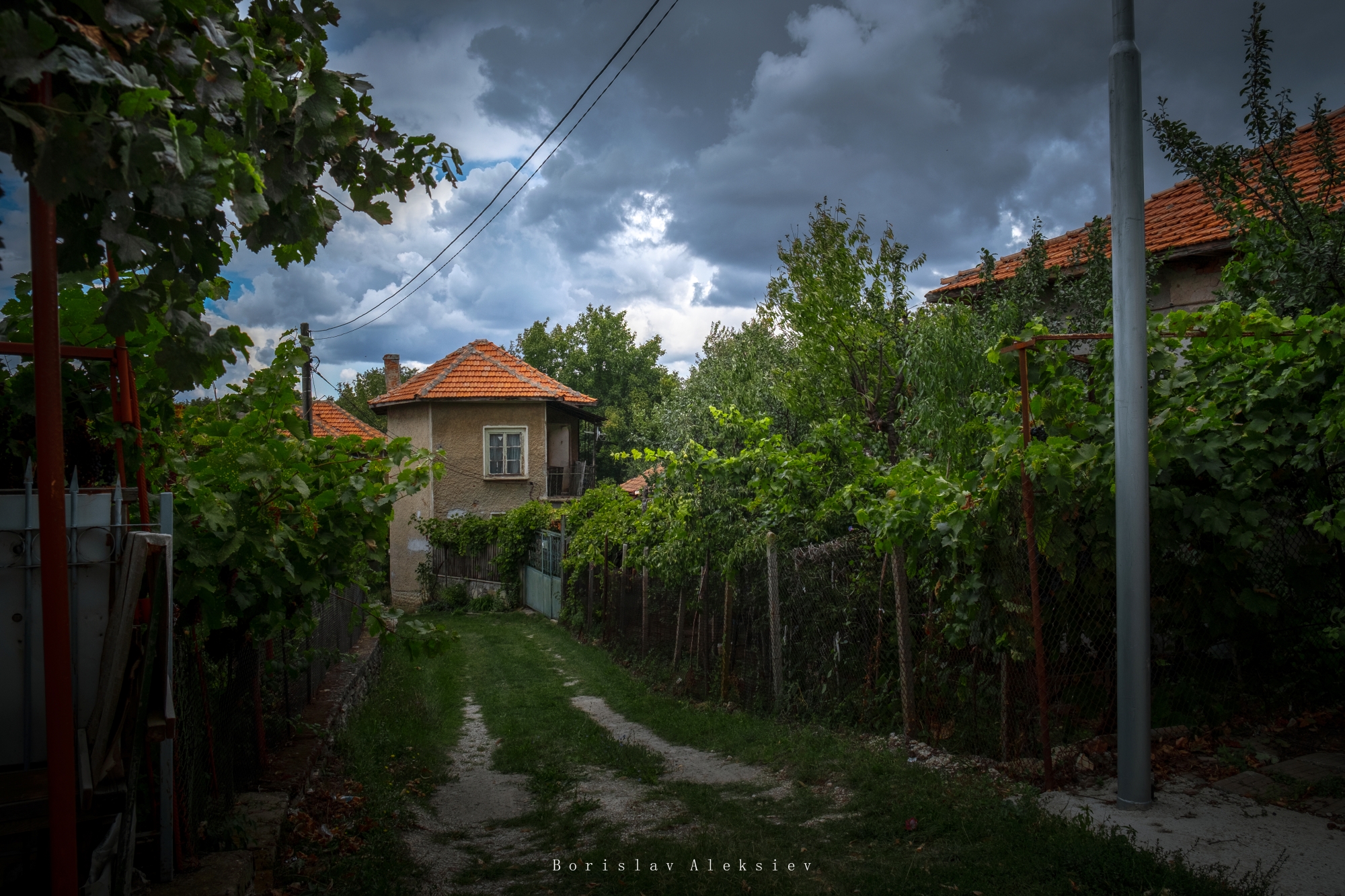 old village,storm,house,clouds,light,dark,building,plant,green,tree,, Алексиев Борислав