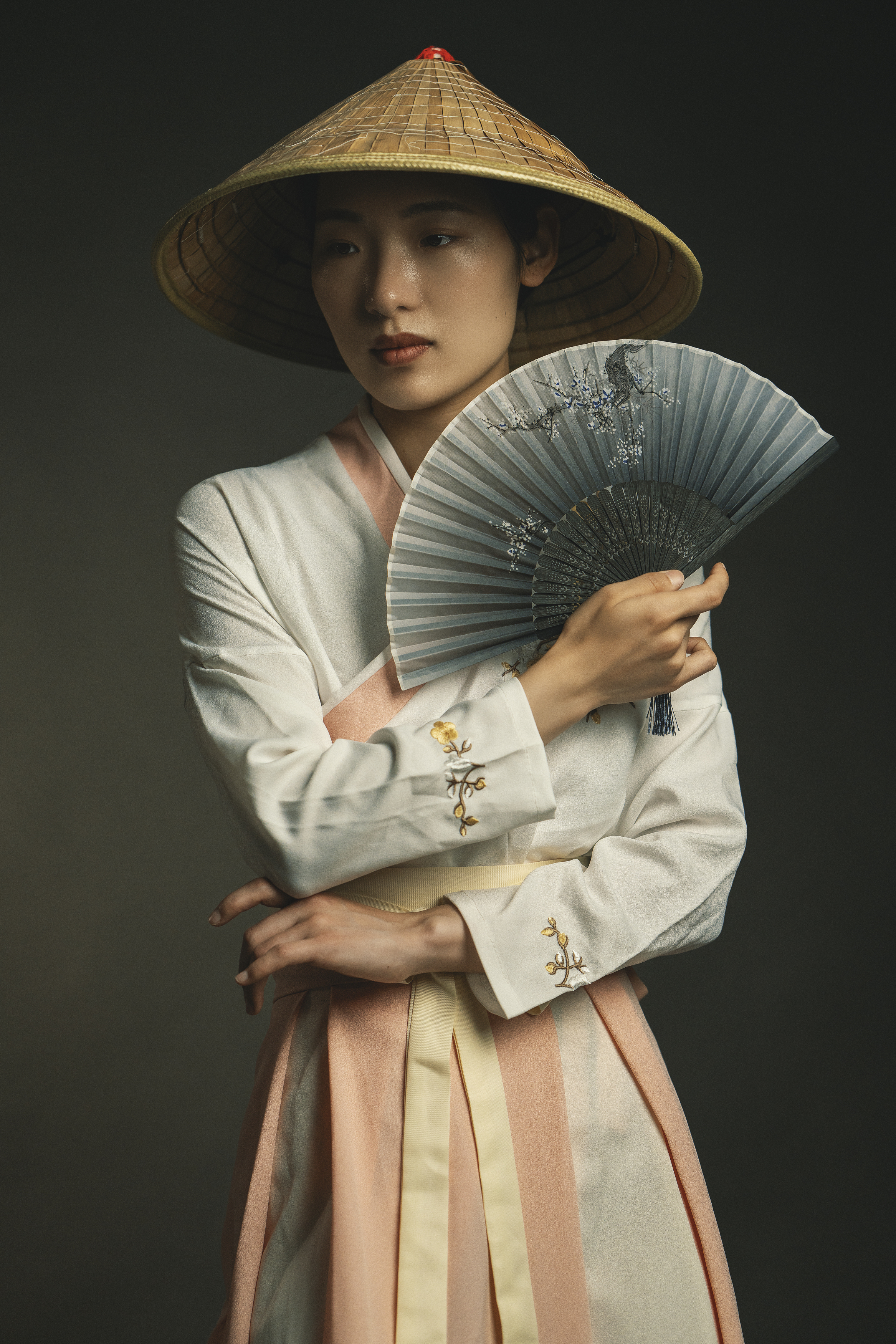 attractive, beauty, chinese girl, dreaminess, dress, elegance, fashion, femininity, front view, grace, hat, individuality, indoors, lifestyles, looking, one person, painted fan, portrait, pose, standing, studio shot, traditional clothing, young woman, Alex Tsarfin