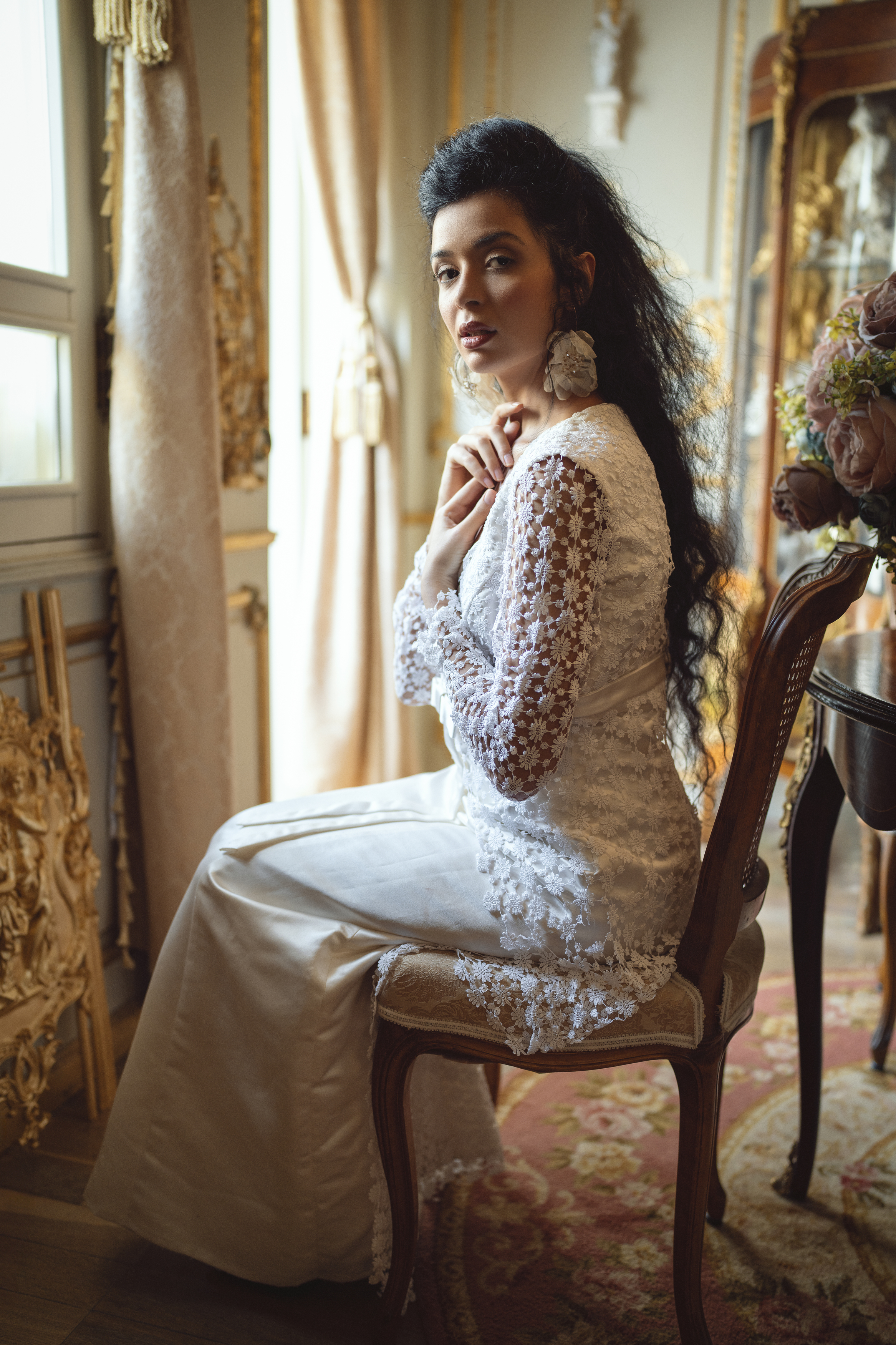 ball gown, beautiful woman, carpet, chair, earrings, elegance, fashion, femininity, flowers, grace, human face, indoors, lifestyles, looking at camera, louis XV, one person, portrait, retro, rococo, sensuality, side view, sitting, table, vintage, windows, Alex Tsarfin