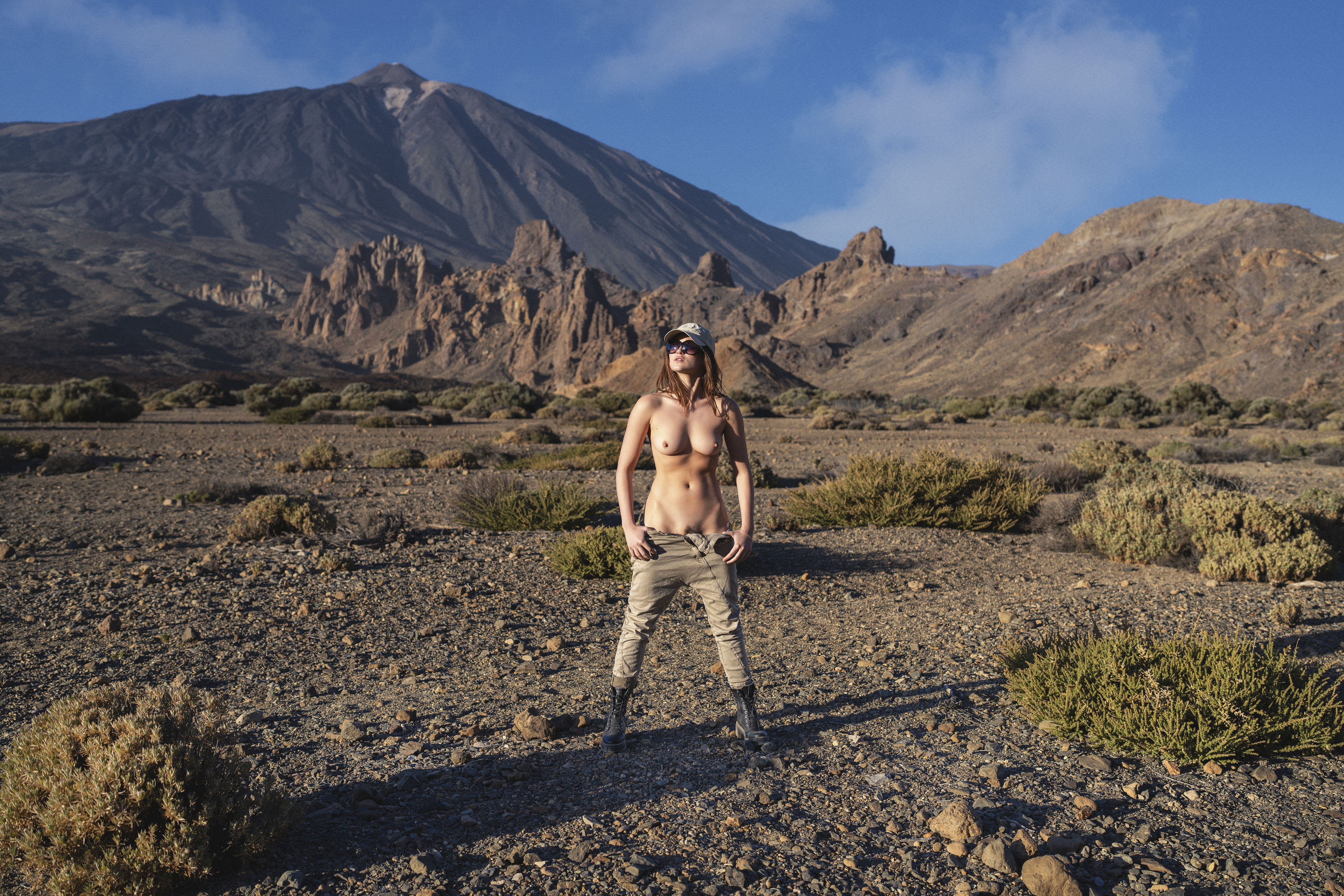 beautiful woman, beauty in nature, cap, clouds, desert, el teide, female, front view, golden hour, jeans, lifestyles, looking, mountains, nude, one person, outdoors, rocks, seductive women, sensuality, skies, standing, sunset, trousers, young woman, Alex Tsarfin