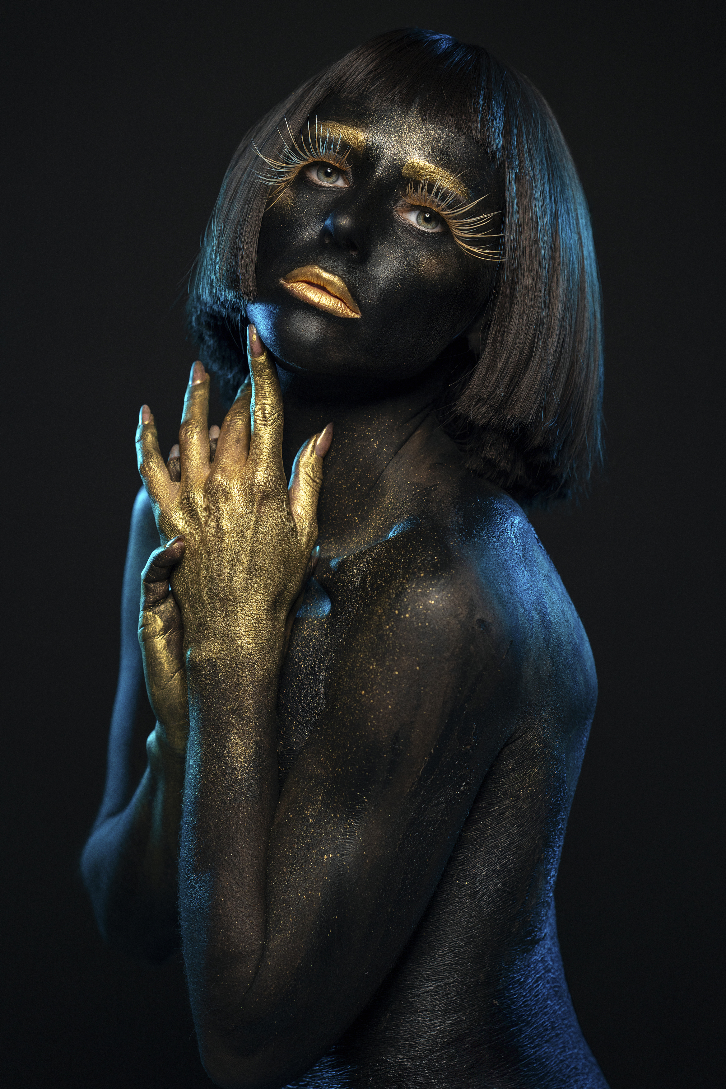 art, beauty, black and gold, blue, creative, dreaminess, elegance, female, femininity, grace, human face, individuality, indoors, light, looking at camera, makeup, one person, portrait, pose, shadow, side view, standing, studio shot, young woman, Alex Tsarfin