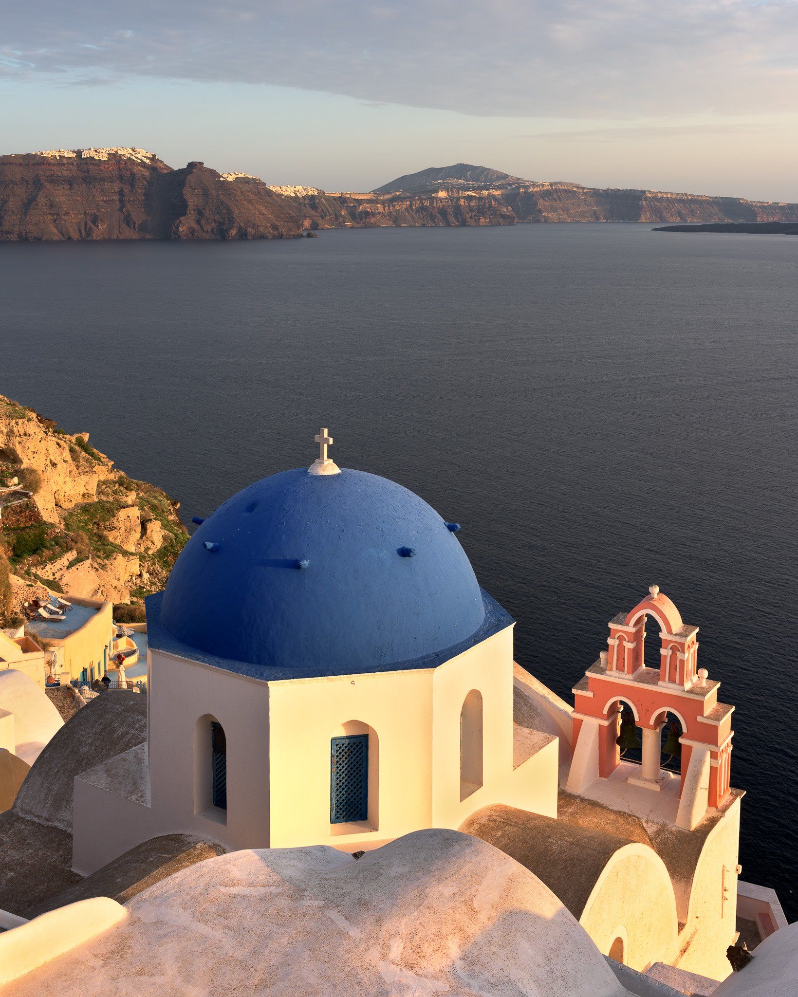 aegean, anastasis, architecture, bell, blue, building, caldera, chapel, church, city, cityscape, cliff, cupola, cyclades, cycladic, dome, europe, evening, fira, greece, house, iconic, island, landmark, landscape, mediterranean, oia, religion, resort, roma, Andrey Omelyanchuk