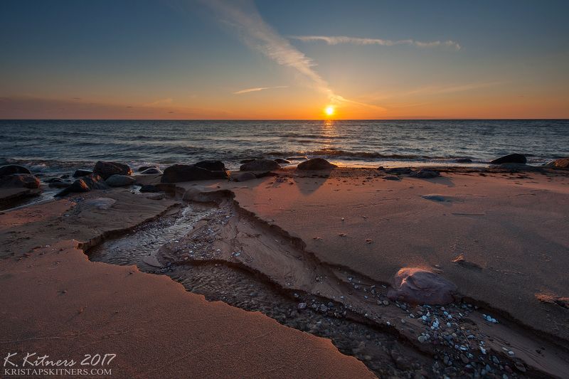 sea seascape water river wave sky clouds stone reflection sunset evening latvia The Last Turnphoto preview