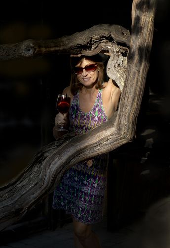 With a glass of wine